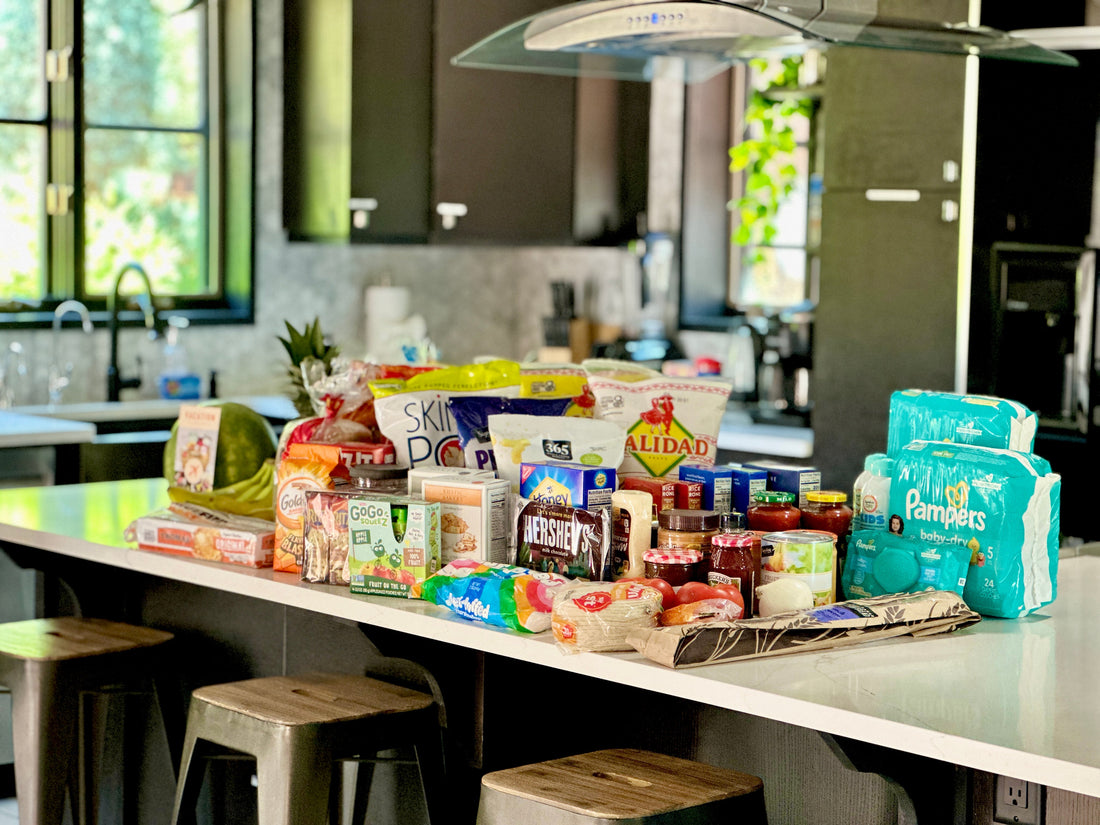 Grocery Shopping done and delivered before you arrive to your vacation rental. Groceries stacked neatly on a kitchen counter of an Airbnb. 