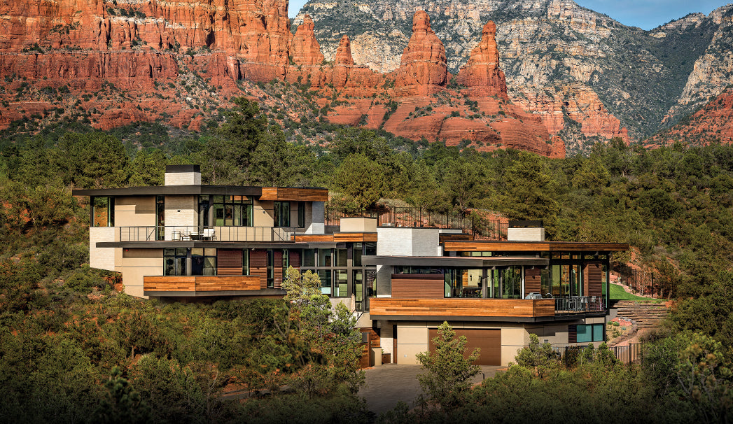 Elevate Your Airbnb Experience: How Vacation Delivery Services Enhance Short-Term Rentals in Sedona. This image shows a luxury house with the back drop of the stunning red rock formations of Sedona.